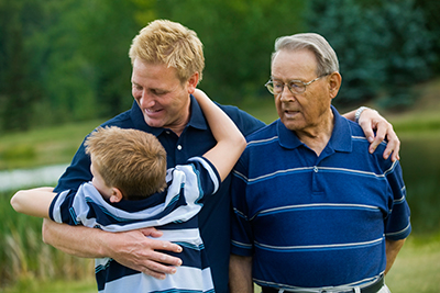 Who is a Caregiver? - Father, son, and grandson image